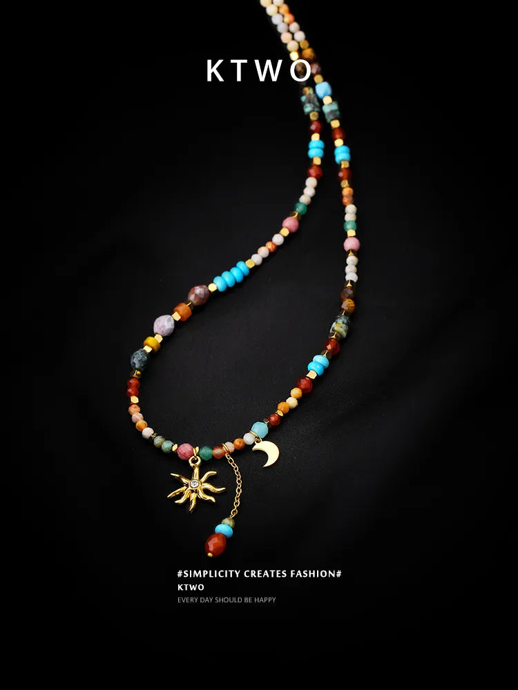 Close-up detail of the ethnic multicolor stone necklace, highlighting the quality of the beads and the sun moon charm.