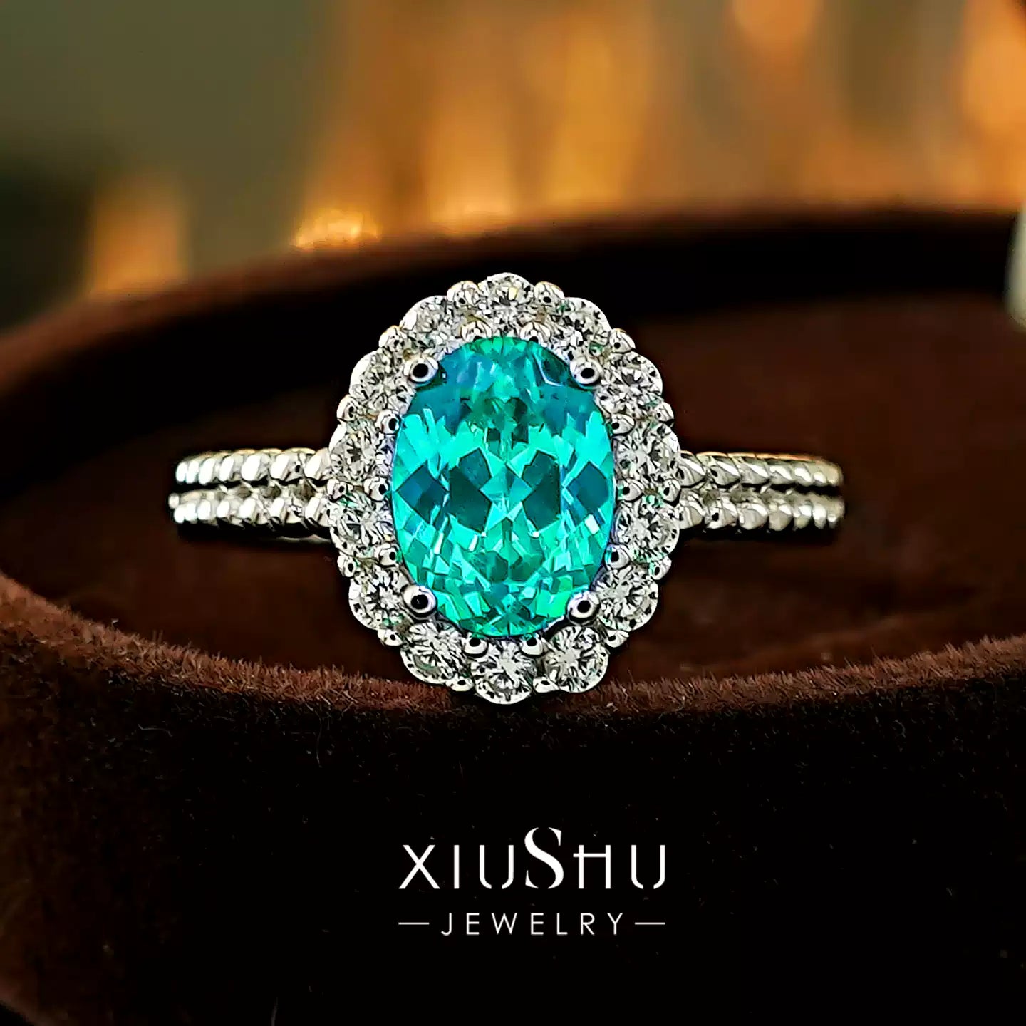 Extreme close-up of the vibrant Paraiba green tourmaline cabochon, highlighting its unique color and smooth, glossy finish.
