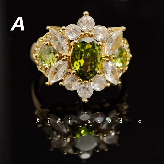 Close-up detail shot of the intricate geometric patterns and rich olive green finish on this adjustable statement ring.