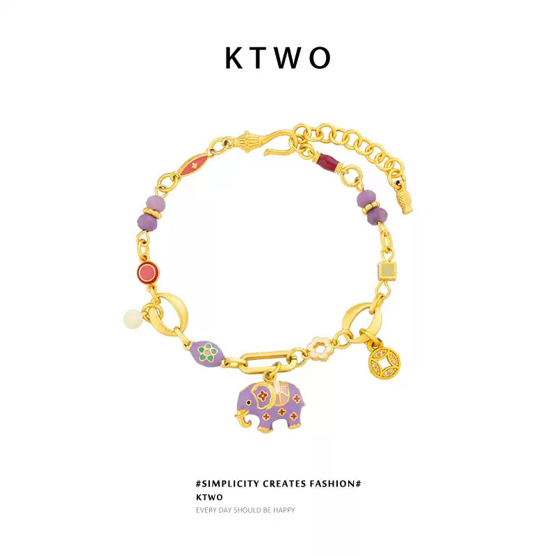 Front view of the handmade purple elephant charm bracelet with unique drip-glaze finish