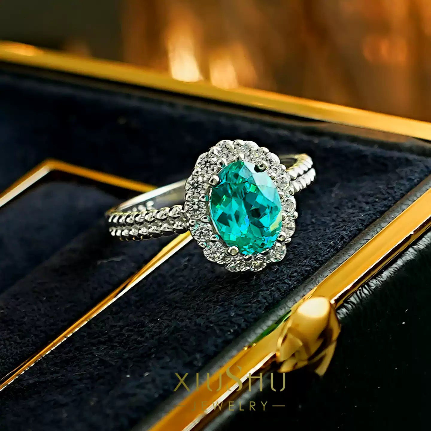 Side profile of the oval cabochon Paraiba ring, showing the solid sterling silver band design and craftsmanship.