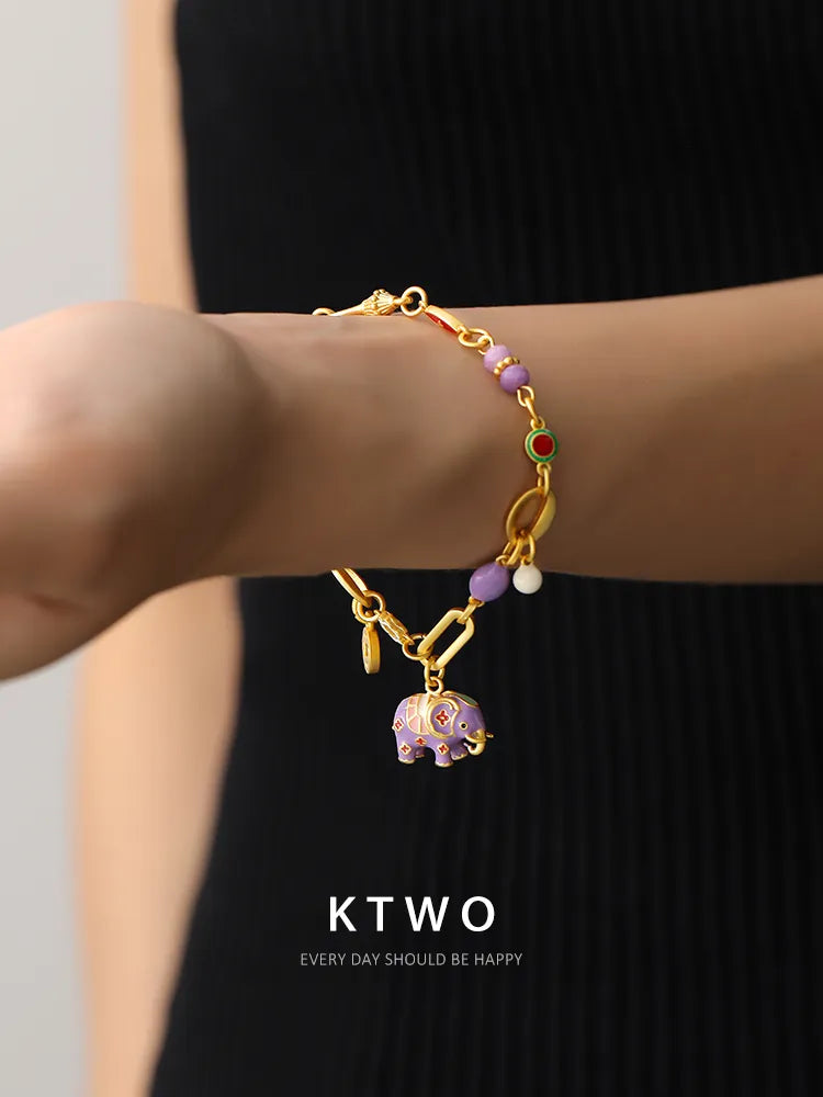 Adjustable boho purple elephant bracelet being worn, showing its perfect fit.