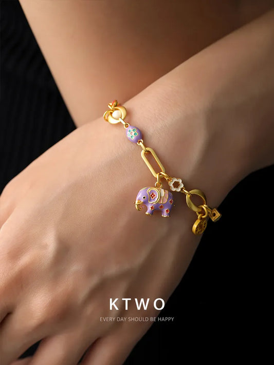 Close-up of the artisanal drip-glaze texture and purple color on the elephant charm