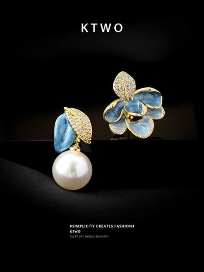 Lifestyle flatlay of asymmetric pearl earrings, a perfect unique gift idea for her.