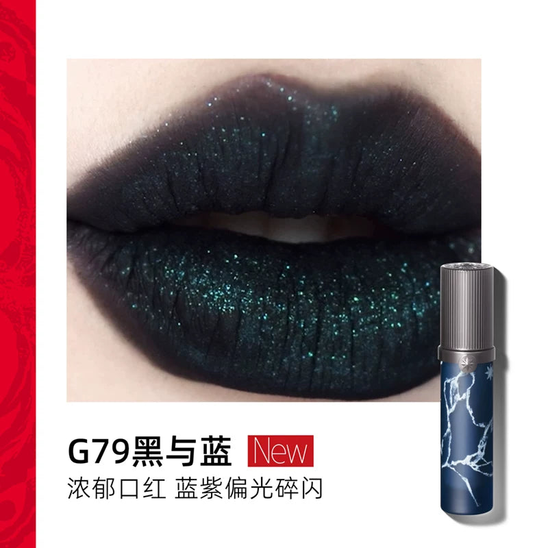Close-up of Girlcult Lipstick G79: A richly pigmented matte black base infused with a galaxy-like sparkle that shifts from blue to purple. Perfect for avant-garde or celestial makeup looks.