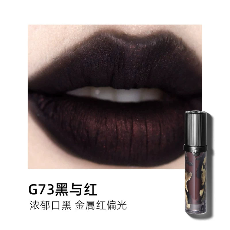Swatch of Girlcult Lipstick G73: A bold matte black base with a vibrant red metallic duochrome shift, perfect for creating avant-garde, gothic, or festival makeup looks.