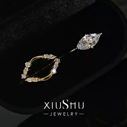 Close-up of the sparkling sterling silver rings on a dark background, emphasizing the brilliant light reflection and diamond-like fire.