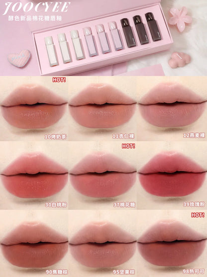 Nine nude shades from the JOOCYEE velvet lip gloss series were applied to the lips for comparison.