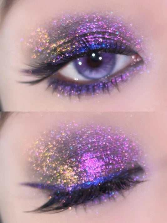 Extreme close-up of a dramatic eye makeup look featuring our eyeshadow. The multi-chrome pigment displays an intense holographic sparkle, with colors shifting from purple to blue across the lid.