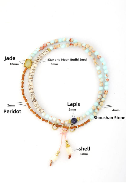 Close-up look at the materials used in our multi-wrap bracelet: featuring genuine Lapis Lazuli, Peridot gemstones, natural Bodhi Seeds, Jade, and a shell flower charm.