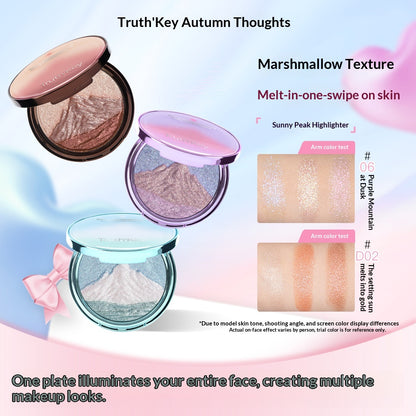 Blended color swatches of the buildable, tri-tone Sunlit Peaks highlighter