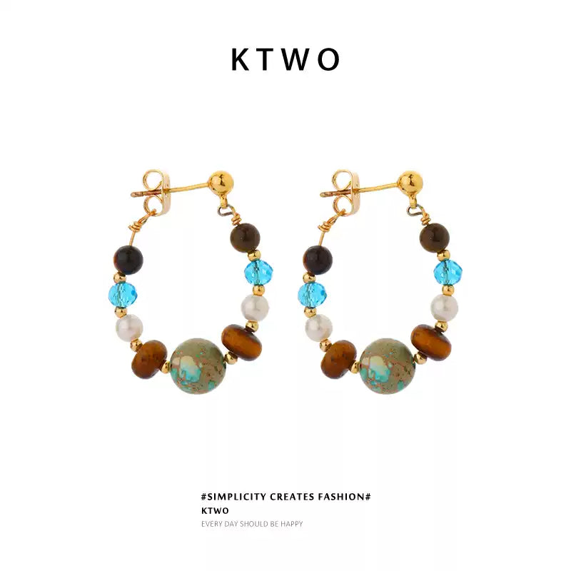 Vintage tiger eye and turquoise drop dangle earrings for women on a white background.