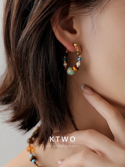 Style idea: wearing our everyday turquoise dangle earrings with a casual outfit.